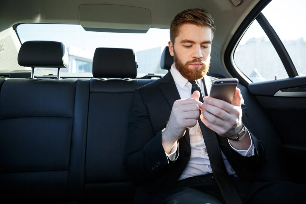 handsome bearded business man suit using mobile phone